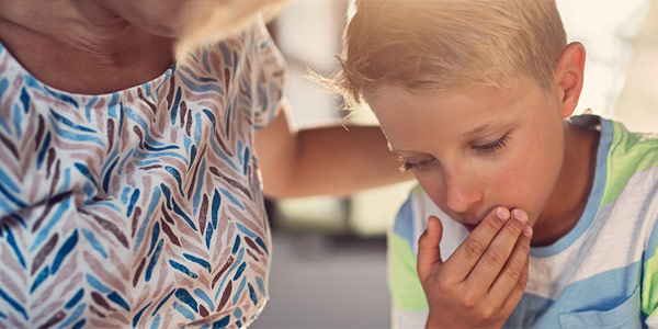 Child with whooping cough, coughing.