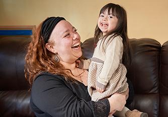 Rafaela smiling and laughing with her mom.